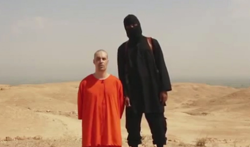 This undated image shows a frame from a video released by Islamic State militants Tuesday, Aug. 19, 2014, that purports to show the killing of journalist James Foley by the militant group. Foley, from Rochester, N.H., went missing in 2012 in northern Syria while on assignment for Agence France-Press and the Boston-based media company GlobalPost. (AP Photo) 