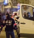 Police investigate an area where terror suspect Mohamed Abrini was arrested earlier today, in Brussels on Friday April 8, 2016. The federal prosecutor's office confirmed a fugitive suspect in the Nov. 13 Paris attacks was arrested in Belgium on Friday, after a raid Belgian authorities said was linked to the deadly March 22 Brussels bombings. The suspect, Mohamed Abrini, is believed to be the mysterious "man in the hat" who escaped the double bombing at Brussels airport, but further investigation is needed to determine Abrini is the third suspect of the airport attack.