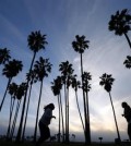 In this Feb. 23, 2016,  women run as the sun sets in San Diego. Life expectancy for white women has fallen a little, according to a new government report. The dip is small - white women lost about five weeks from their predicted lifespan in 2014, compared to 2013, the Centers for Disease Control and Prevention reported Wednesday, April 20, 2016.