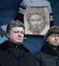 In this Sunday, Feb. 9, 2014 file photo then Ukrainian lawmaker and opposition leader Petro Poroshenko, left, and then Ukrainian opposition leader Arseniy Yatsenyuk attend a rally in the Independence Square in Kiev, Ukraine. Prime Minister Arseniy Yatsenyuk, one of the leaders of the Maidan protests, announced Sunday that he would submit his resignation to parliament on Tuesday. This cleared the way for the parliament speaker, Volodymyr Groysman, to replace him and form a new government. The parties led by Yatsenyuk and President Petro Poroshenko will still dominate the governing coalition, but the choice of Groysman, a member of Poroshenko’s party, was seen as strengthening the hand of the president.