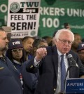 TWU Local 100 President John Samuelsen listens at left as Democratic presidential candidate, Sen. Bernie Sanders, I-Vt. speaks after being endorsed by TWU Local 100, Wednesday, April 13, 2016, in the Brooklyn borough of New York.