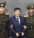 Kim Dong Chul, center, a U.S. citizen detained in North Korea, is escorted to his trial Friday, April 29, 2016, in Pyongyang, North Korea. A North Korean court has sentenced an ethnic Korean U.S. citizen to 10 years in prison for what it called acts of espionage.