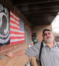 In this Monday, March 21, 2016, photo, Ronald Tillman stands outside of his apartment in Lincoln, Neb. Tillman, a Navy veteran, spent three years in prison for selling morphine pills to a police informant, and is now ineligible for food stamps despite his bipolar disease and a debilitating back injury that have made it hard for him to work. Nebraska is among a dwindling number of states that still enforce a lifetime ban on drug offenders receiving food stamps.