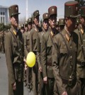 North Korean soldiers walk in the Ryomyong residential area after attending its official opening ceremony on Thursday, April 13, 2017, in Pyongyang, North Korea. Japan's Prime Minister Shinzo Abe, speaking at a parliamentary panel on national security and diplomacy, warned Thursday that North Korea may be capable of firing a missile loaded with sarin nerve gas toward Japan. (AP Photo/Wong Maye-E)