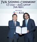 In this photo provided by CJ CGV, Seo Jung (L), chief executive officer of the South Korean company, and Grigoriy Pecherskiy, managing partner of Russia's ADG Group, pose for a photo after signing a contract on the establishment of a joint venture company in Seoul on Oct. 23, 2017. (Yonhap)