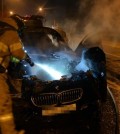 Firefighters put out a fire in a BMW 520d sedan on a road in Hanam, east of Seoul, on Aug. 12, 2018, in this photo provided by the Hanam Fire Station. (Yonhap)