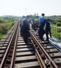 South and North Korean officials conduct a joint survey of cross-border railways in this undated file photo. (Yonhap)