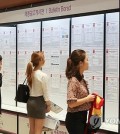 Jobseekers look at recruitment notices during a job fair of foreign-invested companies at a convention center in Seoul on June 14, 2018, in this file photo. (Yonhap)