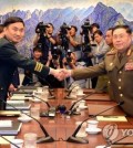 Major Gen. Kim Do-gyun (2nd from L), the chief of South Korea's five-member delegation, shakes hands with Lt. Gen. An Ik-san (2nd from R), the chief of North Korea's delegation, on July 31, 2018, before their talks at the Peace House, a South Korea-controlled building at the truce village of Panmunjom inside the Demilitarized Zone (DMZ) separating the two Koreas, in this photo provided by the Joint Press Corps. (Yonhap)