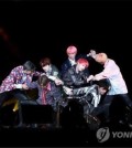 This image shows K-pop band BTS giving a performance. (Yonhap)