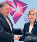 This file photo shows South Korean Foreign Minister Kang Kyung-wha (R) with U.S. Secretary of State Mike Pompeo. (Yonhap)