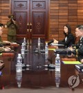 South Korean (L) and North Korean officials hold working-level military talks at the truce village of Panmunjom on Sept. 13, 2018, in this photo provided by Seoul's defense ministry. (Yonhap)