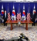 South Korean President Moon Jae-in (third from L, at podium) and U.S. President Donald Trump (second from R, at podium) hold a joint press conference before signing a joint statement welcoming the conclusion of negotiations to revise the South Korea-U.S. free trade agreement in New York on Sept. 24, 2018. (Yonhap)