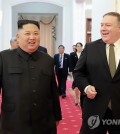 This AP photo shows U.S. Secretary of State Mike Pompeo (R) with North Korean leader Kim Jong-un in Pyongyang on Oct. 7, 2018. (Yonhap)