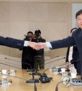 In this Joint Press Corps photo, North Korean Vice Sports Minister Won Kil-u (L) and his South Korean counterpart, Roh Tae-kang, shake hands during their sports talks at the joint liaison office in Kaesong, North Korea, on Nov. 2, 2018. (Yonhap)