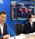 President Moon Jae-in (L) speaks during a meeting with heads of South Korea's biotech firms in Seoul on March 25, 2020. (Yonhap)