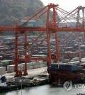 This photo, taken Dec. 7, 2021, shows stacks of containers at a port in South Korea's southeastern city of Busan. (Yonhap)