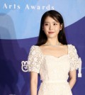 In this file photo, singer-actress IU poses for photos at the 55th Baeksang Arts Awards held at COEX, southern Seoul, on May 1, 2019. (Yonhap)