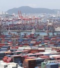 This file photo, taken July 1, 2022, shows stacks of containers at a port in South Korea's southeastern city of Busan. (Yonhap)