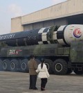 FILE PHOTO: North Korean leader Kim Jong Un, along with his daughter, inspects an ICBM in this undated photo released by KCNA