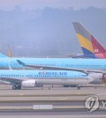 Airplanes remain parked at Incheon International Airport. (Yonhap)