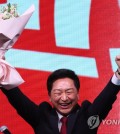 Rep. Kim Gi-hyeon, the new leader of the ruling People Power Party, raises his hands up in victory after winning the party leadership race in a national convention at the KINTEX exhibition center in Goyang, just northwest of Seoul, on March 8, 2023. (Yonhap)