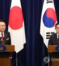 Japanese Prime Minister Fumio Kishida (R) speaks during a joint news conference with President Yoon Suk Yeol after their summit in Tokyo on March 16, 2023. (Yonhap)