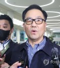 In this file photo, Cho Hyun-chun (C), former head of the now-defunct Defense Security Command, speaks to reporters at Incheon International Airport, west of Seoul, on March 29, 2023. (Yonhap)