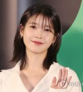 Singer-actor IU poses for a photo during a promotional event for the sports comedy film "Dream" at Megabox COEX on April 17, 2023. (Yonhap)