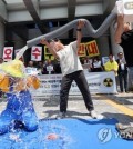 Environmental activists stage a rally in Jeonju, North Jeolla Province, southwestern South Korea, on June 8, 2023, to express their objection to Japan's decision to discharge radioactive water from the crippled Fukushima nuclear power plant into the sea. (Yonhap)