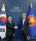 South Korean Foreign Minister Park Jin (R) shakes hands with ASEAN Secretary General Kao Kim Hourn before their talks at the foreign ministry in Seoul on June 16, 2023. (Yonhap)