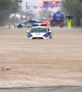 This photo provided by a reader shows a police car submerged in rainwater in the southern city of Gunsan on July 14, 2023. (PHOTO NOT FOR SALE) (Yonhap)