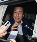 Daegu Mayor Hong Joon-pyo answers reporters' questions while leaving the National Assembly in Seoul, in this file photo taken July 17, 2023. (Yonhap)