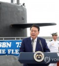 President Yoon Suk Yeol delivers remarks next to the USS Kentucky, a U.S. nuclear-capable ballistic missile submarine, at a naval base in the southeastern port city of Busan on July 19, 2023. (Pool photo) (Yonhap)