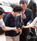 Choi Eun-soon (C), the mother-in-law of President Yoon Suk Yeol, arrives at the Uijeongbu District Court in the city of the same name, 22 kilometers northeast of Seoul, on July 21, 2023. (Yonhap)