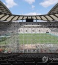 Workers install a makeshift stage for the "K-pop super live" concert, the highlight event for the 2023 World Scout Jamboree, at Seoul World Cup Stadium in western Seoul on Aug. 9, 2023. The concert and the closing ceremony of the world gathering will be held at the stadium on Aug. 11. (Yonhap)