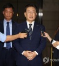 In this file photo, Democratic Party leader Lee Jae-myung (C) speaks to reporters after undergoing questioning at the Seoul Central District Prosecutors Office in southern Seoul on Aug. 18, 2023. (Yonhap)