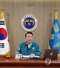 President Yoon Suk Yeol (C) presides over a Cabinet meeting at the presidential office in Seoul on Aug. 21, 2023, as the four-day Ulchi civil defense drill kicked off earlier in the day as part of South Korea and the United States' joint annual military exercise, the Ulchi Freedom Shield (UFS). The UFS exercise against North Korean nuclear and missile threats will run until Aug. 31. (Yonhap)