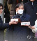 Former Justice Minister Cho Kuk (C) talks to reporters at the Seoul Central District Court in southern Seoul in this file photo taken Feb. 3, 2023. (Yonhap)