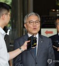 Rep. Choe Kang-wook (C) of the main opposition Democratic Party speaks to reporters outside the Supreme Court in Seoul on Sept. 18, 2023, after the court upheld a suspended prison term for him for fabricating an internship certificate for the son of former Justice Minister Cho Kuk. (Yonhap)