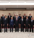 President Yoon Suk Yeol (front row, C) poses for a photo with members of the Korea-Japan Friendship Association and the Japan-Korea Friendship Association at the presidential office in Seoul on Oct. 13, 2023, in this photo provided by the office. (PHOTO NOT FOR SALE) (Yonhap)