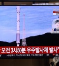 People watch news on North Korea's satelite launch aired on television, in this file photo taken Aug. 24, 2023. (Yonhap)