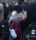 Citizens are bundled up in Seoul on Dec. 21, 2023, as an arctic cold snap hit South Korea. (Yonhap)