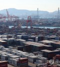 Shipping containers are stacked at a pier in South Korea's largest port city of Busan, in this file photo taken Dec. 1, 2023. (Yonhap)