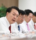 President Yoon Suk Yeol (L) holds a meeting with his senior secretaries at the presidential office in Seoul on Jan. 2, 2024, in this photo provided by his office. (PHOTO NOT FOR SALE) (Yonhap)