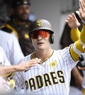 May 29, 2024; San Diego, California, USA; San Diego Padres shortstop Ha-Seong Kim (7), is congratulated after hitting a solo home run during the third inning against the Miami Marlins at Petco Park. Mandatory Credit: Denis Poroy-USA TODAY Sports