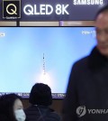 This file photo, taken Nov. 22, 2023, shows a news report on North Korea's launch of a military spy satellite being aired on a television at Seoul Station in central Seoul. (Yonhap)