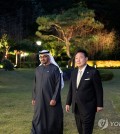 South Korean President Yoon Suk Yeol (R) takes a stroll with United Arab Emirates President Mohamed bin Zayed Al Nahyan at his residence in Seoul on May 29, 2024, in this photo provided by the presidential office. (PHOTO NOT FOR SALE) (Yonhap)
