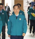 Prime Minister Han Duck-soo (C) enters a conference room in Seoul to hold a press briefing on May 16, 2024. (Yonhap)