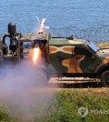 Marines on the northwestern border island of Yeonpyeong fire a Spike anti-tank missile into waters off the island on June 26, 2024. (Yonhap)